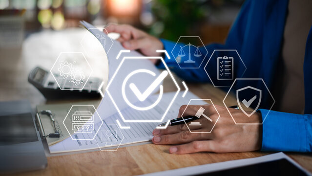 Compliance officer reviewing legal documentation and corporate governance policies with data security, risk management, regulatory compliance, business protection, and audit control systems.