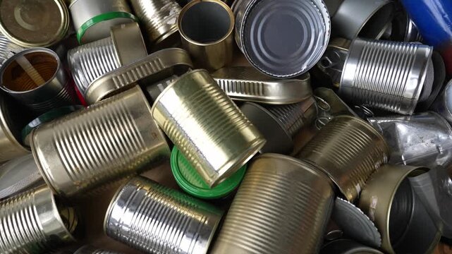Huge pile of empty metal cans recycling and pollution concept