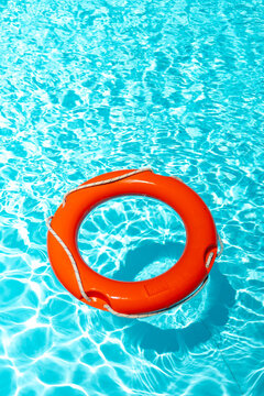 An orange floating buoy in a swimming pool