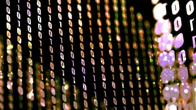 Golden binary code digital data stream on screen