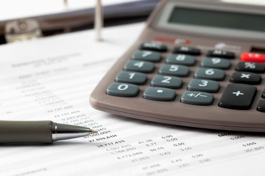 Pocket calculator, pen and documents