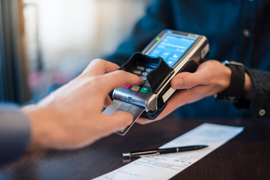 Man using credit card reader, close-up