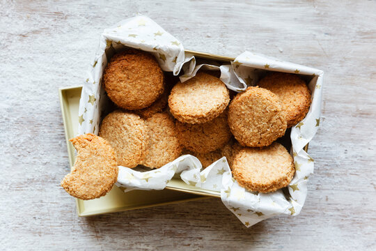 Box of whole grain cocos cookies on wood