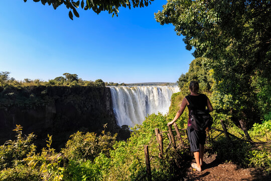 Southern Africa, Zimbabwe, tourist looking at Victoria Falls