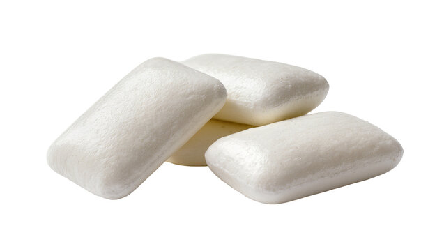 Four white rectangular chewing gum pieces stacked