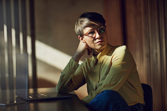 Businesswoman sitting in her sustainable office, portrait