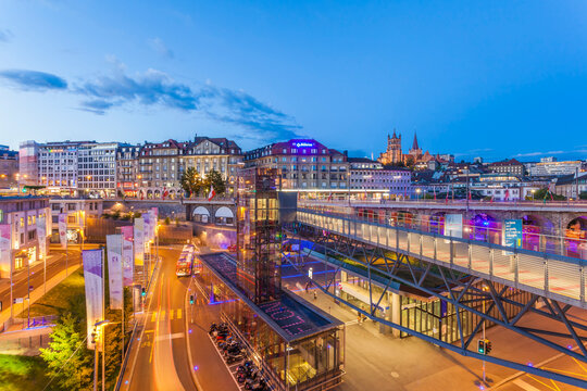 Switzerland, Lausanne, traffic in the city at dusk