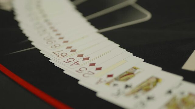  A close-up shot of playing cards fanned out on table