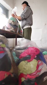Used clothes in bags for recycling and donation