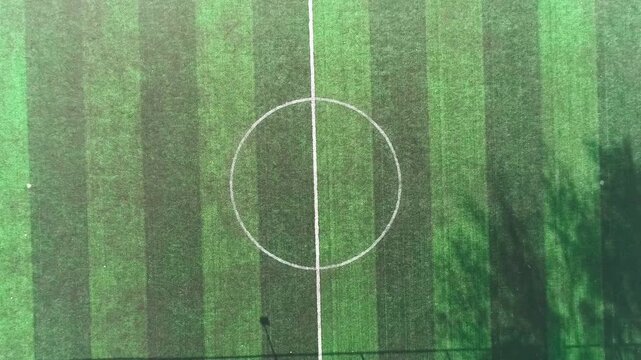 Tashkent, Uzbekistan - 06 06 2025: Aerial Top View of Empty Outdoor Soccer Field with Track