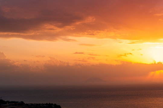 beautiful sunrise or sunset seascape with amazing calm sea water with waves and colorful amazing cloudy morning sky on background