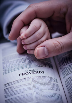 Generational wisdom held by gentle hands over open book
