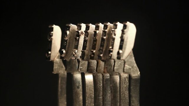 The word " copyright " with retro typewriter hammers isolated on black 