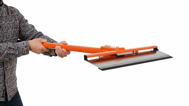 A person holding an orange floor squeegee tool against a white background