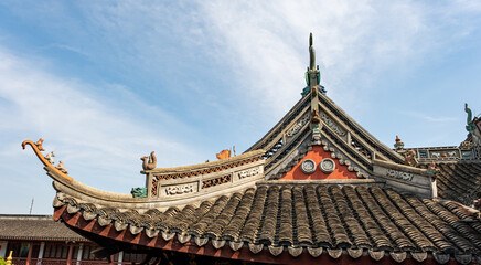 Fototapeta premium a traditional Chinese building roof with characteristic swallowtail-style eaves that curve upwards