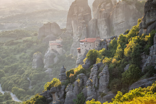 Amazing panoramic view of the Meteora valley with the monasteries in the golden hour of the sunset, near Kastraki, Greece.