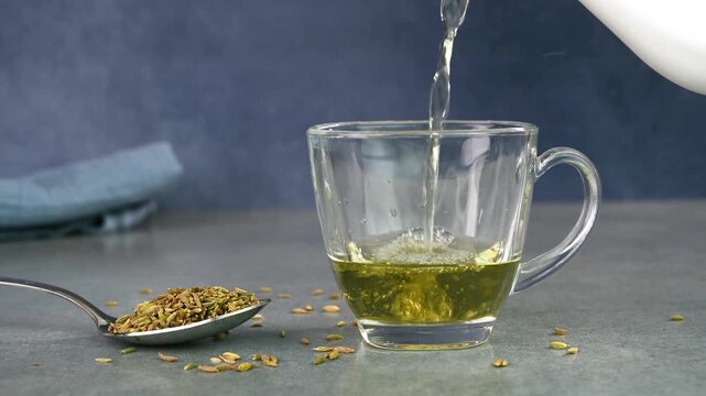 Serving fennel water in a glass cup.