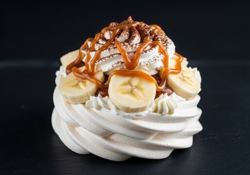Delicious banoffee pavlova dessert with caramel and whipped cream