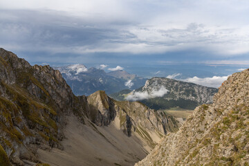 Fototapeta premium Scenic alpine mountains near the Col de la Colombière in the Bornes-Aravis massif with green meadows and rugged peaks, Haute-Savoie, French Alps