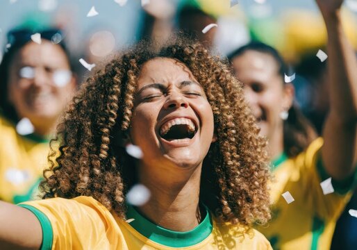 Excited brazilian soccer fan celebrating a goal with confetti falling in a stadium