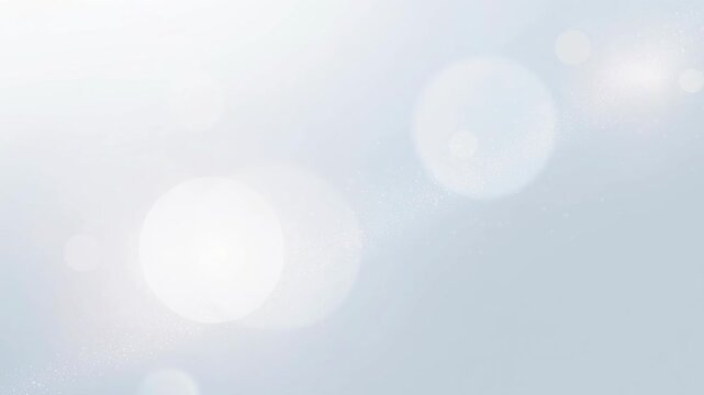 Soft light bokeh background with white and gray glowing circles and subtle sparkles