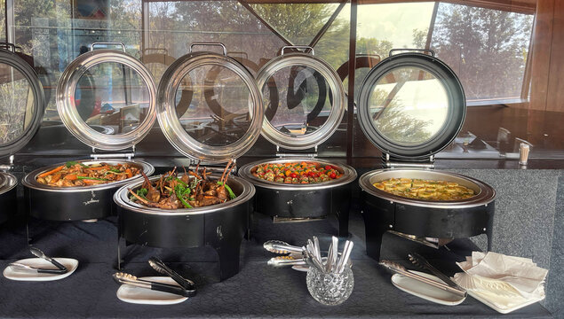 Buffet with hot food chafing dishes.