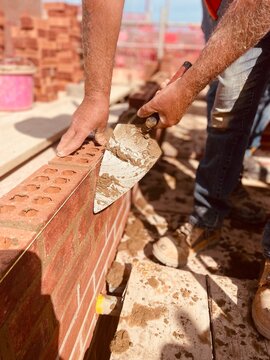 construction worker using a trowel 