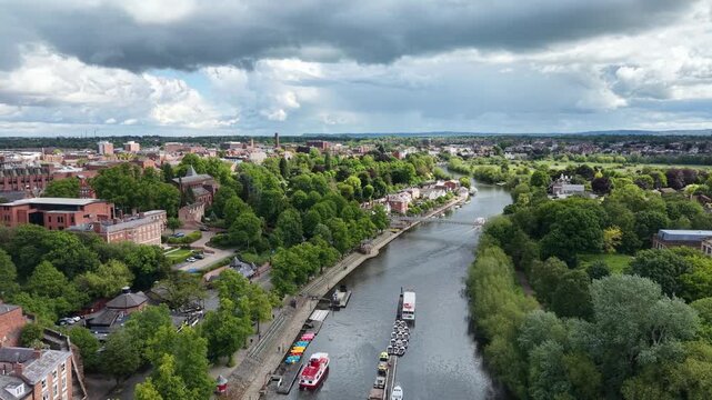 Boats moored on River Dee Chester and queen park bridge drone aerial view
