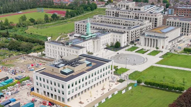 Drone orbit of Walthamstow Town Hall, Waltham Forest council offices and Walthamstow Assembly Hall, showing civic complex, plaza and surrounding parks in East London, UK.