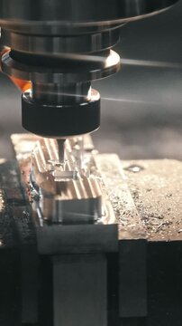 Precision machining process of metal component using CNC milling machine, showcasing continuous cutting action and fluid coolant application in a workshop environment