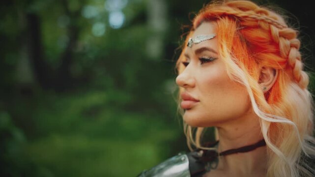 Fantasy woman medieval knight in metal iron armor beauty strong face blonde orange hair creative makeup braid hairstyle. close up eyes lips queen ancient warrior. Fairy tale elf girl princess 4k video