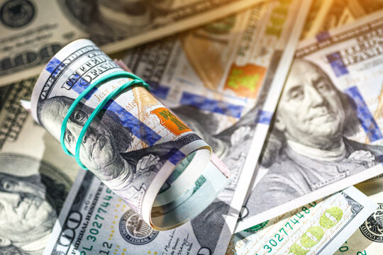 Money american hundred dollar bills.Closeup of assorted American banknotes.US currency scattered on the table.america currency dollor currency.World economic crisis associated with coronovirus.