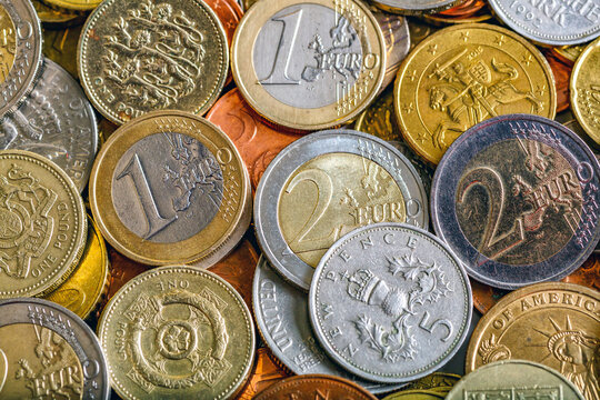 Closeup of assorted  banknotes.Money american hundred dollar bills.Currency of the USA, Britain and the European Union is scattered on the table. Currency, dollar, euro, pound, zloty.