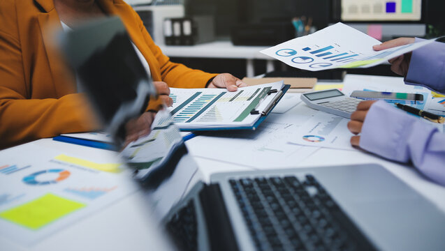 Auditor and accountant team working in office, analyze financial data and accounting record with calculator. Accounting company provide finance and taxation planning for profitable cash flow. Insight