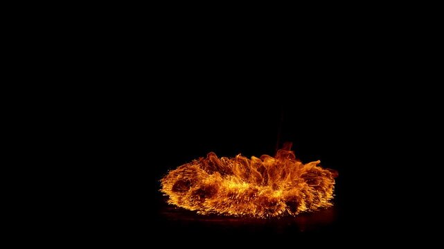 Super slow motion capture of a flickering fire flame isolated on a black background. High-speed footage reveals intricate combustion patterns, fluid motion, and glowing details.