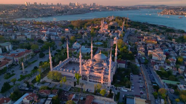 Istanbul cityscape with the iconic Sultan Ahmed Mosque and Hagia Sophia blending historical architecture with the modern Bosphorus skyline. speed ramp, time lapse fly push forward panorama drone