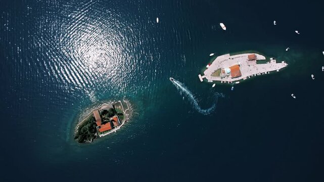 Bright sunlight reflects on deep water. Exciting aerial view captures swift boat navigating vibrant island scenery