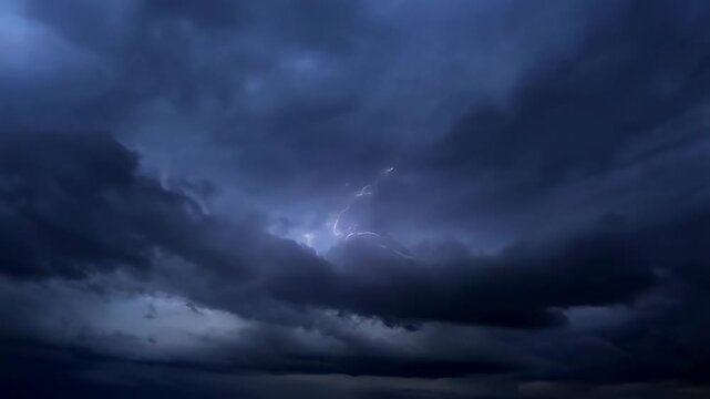 Dramatic lightning strikes illuminating dark storm clouds. Capturing the power and intensity of nature's fury during a thunderstorm