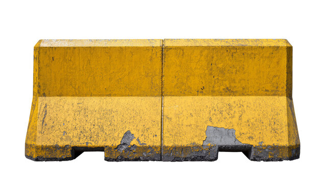 Yellow concrete Jersey barrier with chipped paint and rough texture