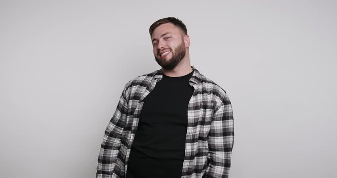 Person shows different expressions in four frames during a simple photo shoot