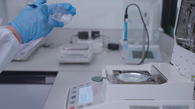 Laboratory experiment conducted by scientist research facility image series controlled environment close-up view scientific process