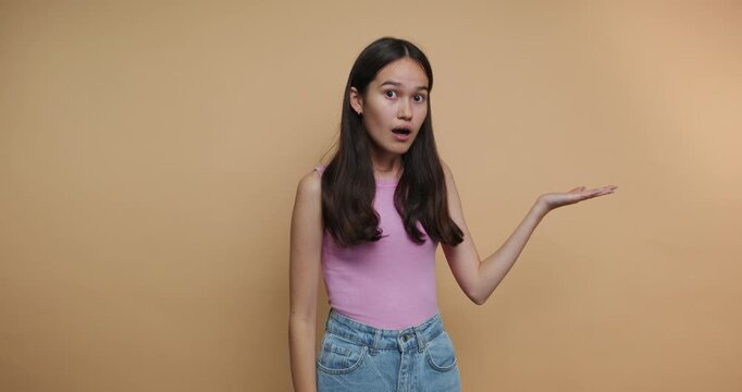 Woman shows various expressions in a studio with a simple backdrop during a creative performance session