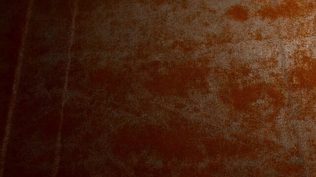 Slow panning shot of rusted metal panels revealing texture variations and patina across industrial interior wall surface