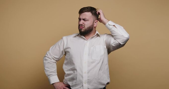 Man shows different expressions of confusion while thinking in a studio setting