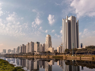 Obraz premium Modern skyline of Sao Paulo, with reflections in the Pinheiros River. Sao Paulo, Brazil.