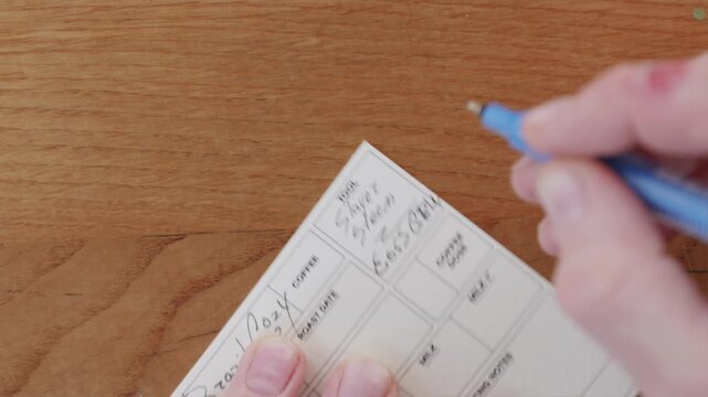 Writing coffee processing data on a paper flavor card