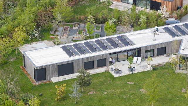 Aerial drone view of an ecovillage in Almere, showing sustainable homes, community living, green space and ecological design.