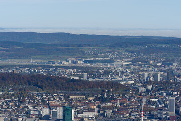 Obraz premium Aerial view from local mountain Uetliberg over Swiss city of Zürich on a sunny autumn day. Photo taken October 29th, 2025, Zurich Uetliberg, Switzerland.