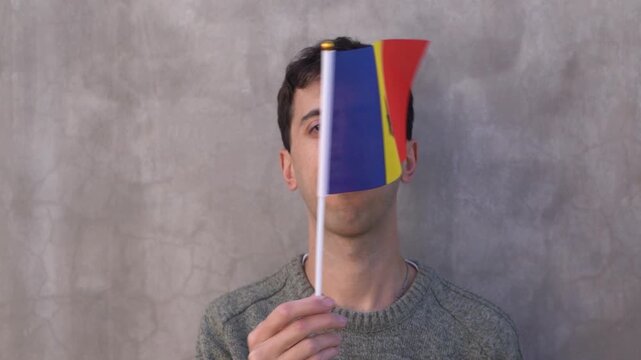 Man waving Moldovan flag. Concept of patriotism. Slow motion.