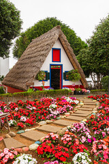 Traditional Casas de Colmo Cottage in Santana on Madeira Island - Vertical shot  Tradycyjny domek Casas de Colmo w Santanie na Maderze - Pionowy kadr © Adrian White